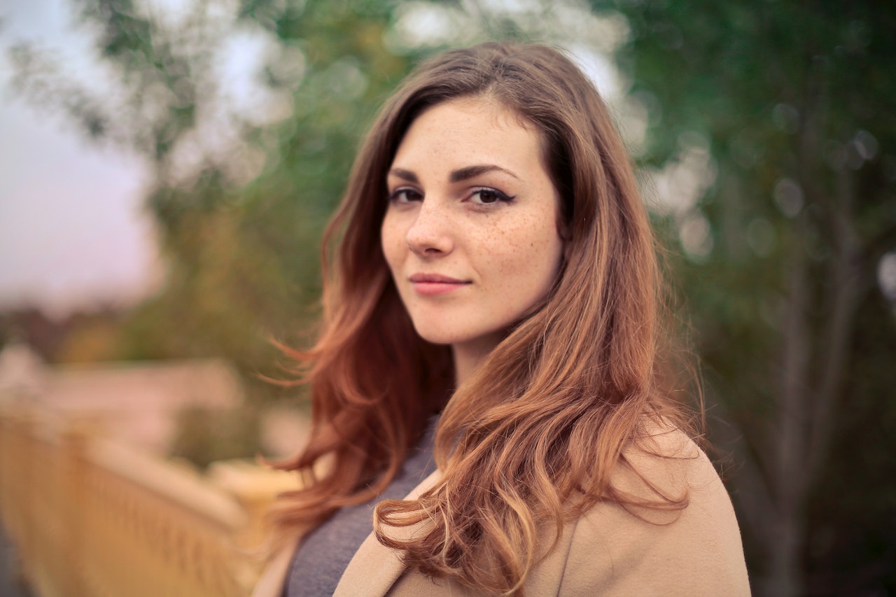 Girl with brown hair looking at the camera