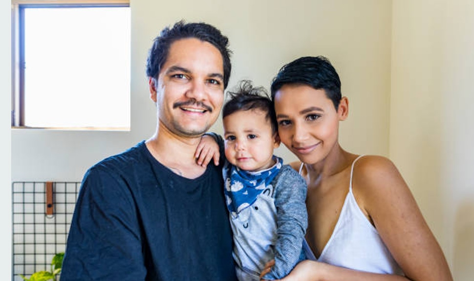 Young first nation family looking at camera